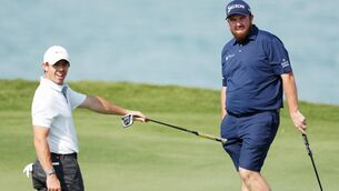 <p>ABU DHABI, UNITED ARAB EMIRATES - JANUARY 18: Shane Lowry of Ireland and Rory McIlroy of Northern Ireland look on from the sixteenth green during a practice round prior to the Abu Dhabi HSBC Championship at Yas Links Golf Course on January 18, 2022 in Abu Dhabi, United Arab Emirates. (Photo by Oisin Keniry/Getty Images)</p>
