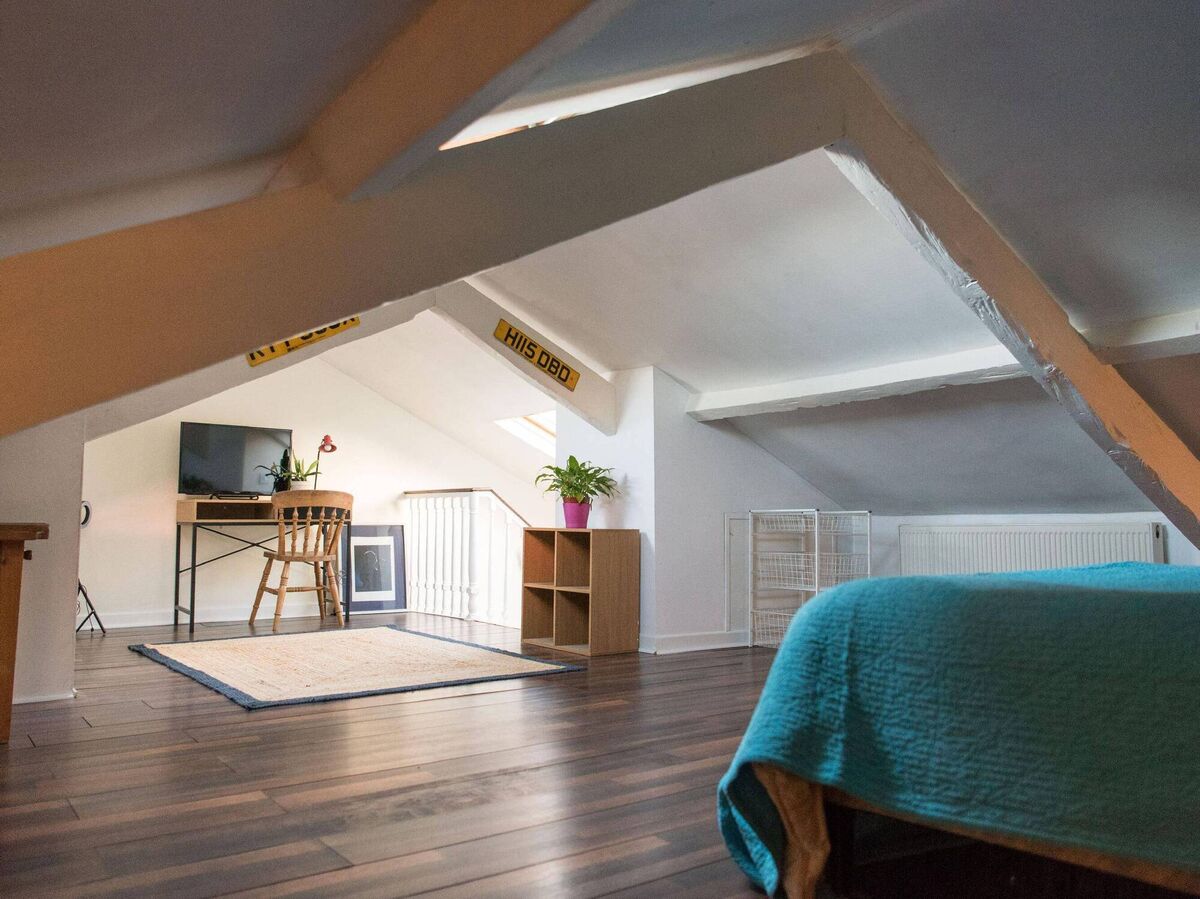 Attic eyrie is atop first floor's three bedrooms. Attic eyrie is atop first floor's three bedrooms.