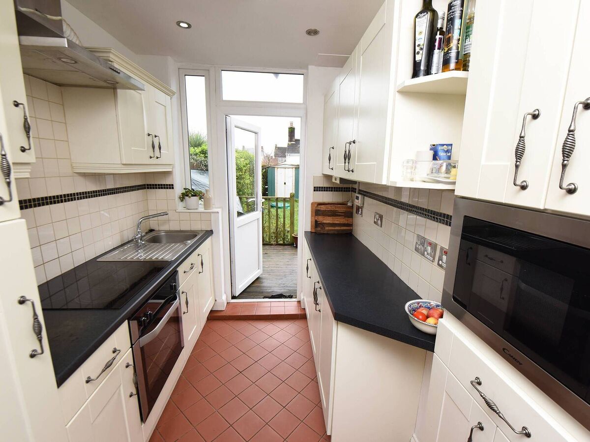 Galley kitchen with deck/garden access Galley kitchen with deck/garden access