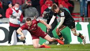 <p>Munster's Andrew Conway (left) attempts to score a try. Picture: Niall Carson</p>