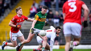 <p>Paul Geaney of Kerry shoots to score his side's second goal, under pressure from John Cooper of Cork, left, during the McGrath Cup final. Picture: Piaras Ó Mídheach/Sportsfile</p>