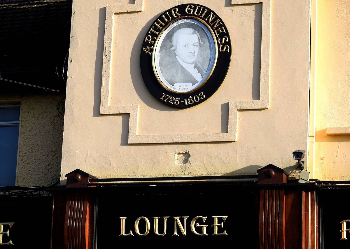 An image of Arthur Guinness on the outside wall of Beaumont House lounge and pub in Shantalla Road, Beaumont, Dublin.
