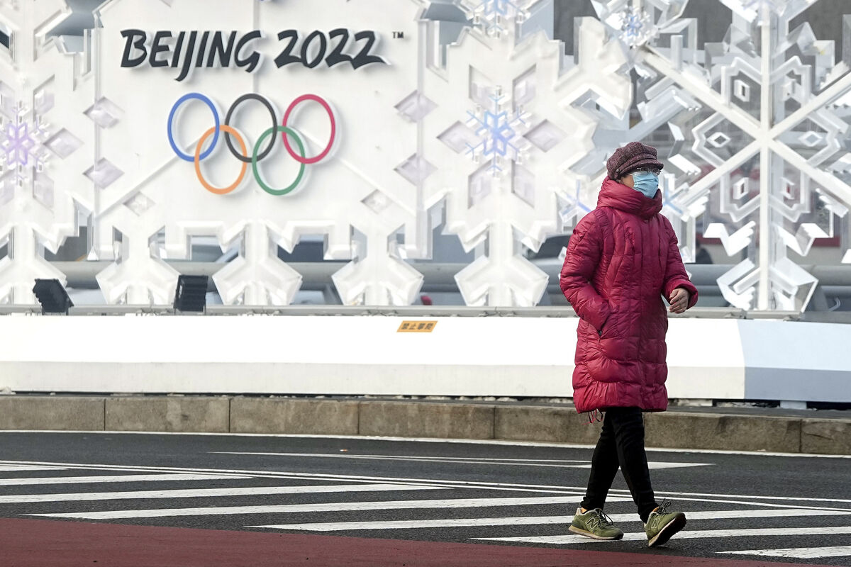 A woman walks near the Olympic Park. Picture: AP Photo/David J Phillip
