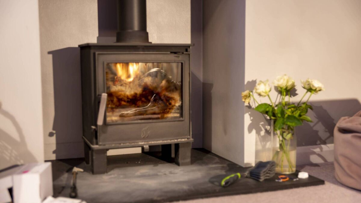 Life Hack: How to clean your wood-burning stove door and use the ash in  your garden