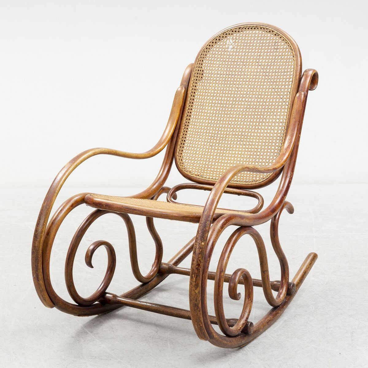 Thonet's romantic vehicles, (pictured here is their Bukowski version) featured everywhere from the Moulin Rouge in Paris to the Studio of Picasso, who sketched his rocker into a anthropomorphic study of his own face.