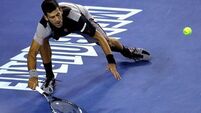 Champion Djokovic dumped out of Aussie Open