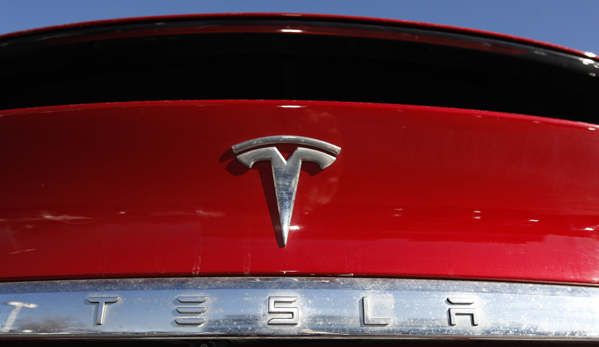 Tesla posts record full-year earnings as vehicle sales soar