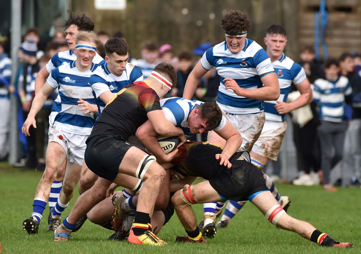 Luke Murphy, Ardscoil Rís attempts to rip the ball from his opposite number Brian Gleeson. Picture: Dan Linehan