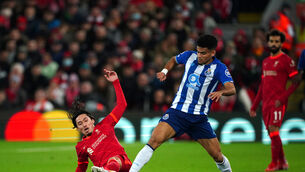 <p>Liverpool’s Takumi Minamino (left) and Porto’s Luis Diaz battle for the ball during the UEFA Champions League, Group B match at Anfield, Liverpool. Picture date: Wednesday November 24, 2021.</p>