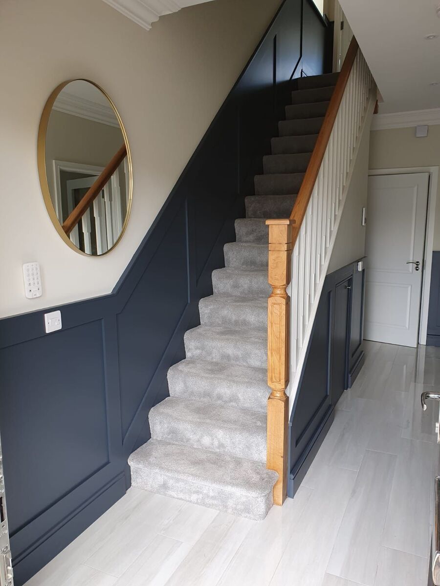 Navy is a trending colour for 2022. In this hallway it's applied in a two-tone with a light neutral above to keep the hallway feeling spacious. Navy is a trending colour for 2022. In this hallway it's applied in a two-tone with a light neutral above to keep the hallway feeling spacious.