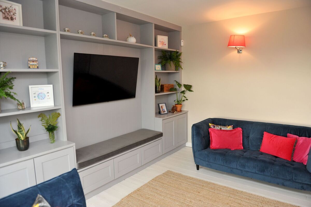 An entertainment and display unit is brought up to date with a light grey painted finish in this family living room. Picture: Larry Cummins An entertainment and display unit is brought up to date with a light grey painted finish in this family living room. Picture: Larry Cummins