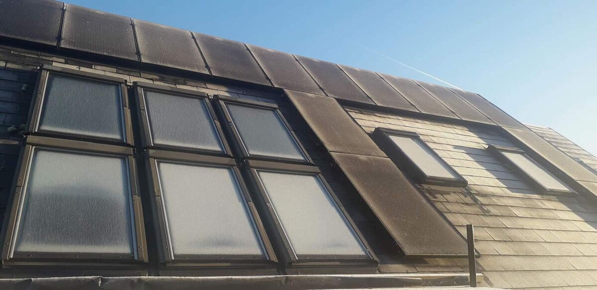 PV panels at the home of Fintan McDara in County Galway, sit crisply around existing roof-lights.