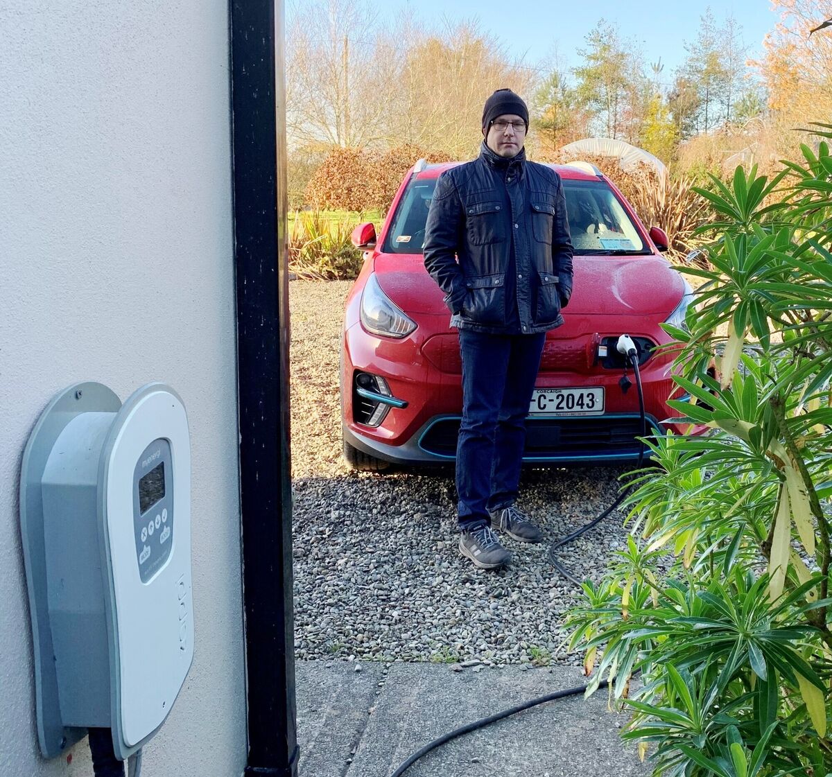 John Murphy with one of his two EV cars and Zappi charger at his home in Innishannon. 