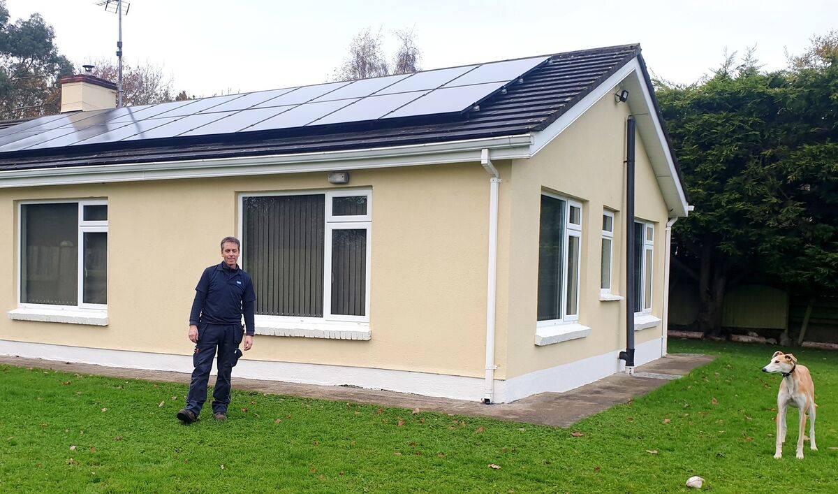 Barry Glynn beside his 6.2kW system of 20 panels. 
