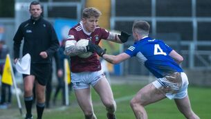 <p>Westmeath’s Luke Loughlin bids to break past Laois defender Alex Mohan in yesterday’s Allianz FL Division 3 clash at MW Hire O’Moore Park. Picture: Denis Byrne</p>