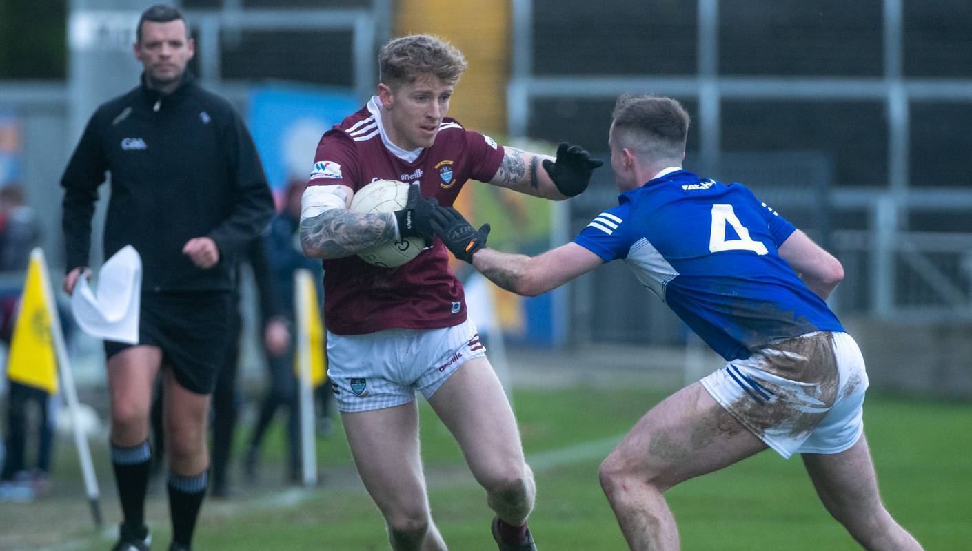 Westmeath’s Luke Loughlin bids to break past Laois defender Alex Mohan in yesterday’s Allianz FL Division 3 clash at MW Hire O’Moore Park. Picture: Denis Byrne