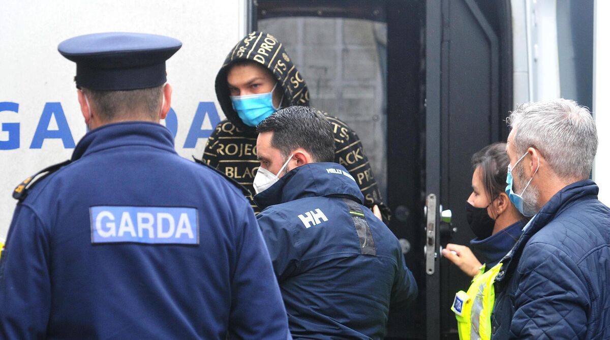 Kamil Szymczak (wearing hoodie) being brought into court. Photo: Larry Cummins Kamil Szymczak (wearing hoodie) being brought into court. Photo: Larry Cummins