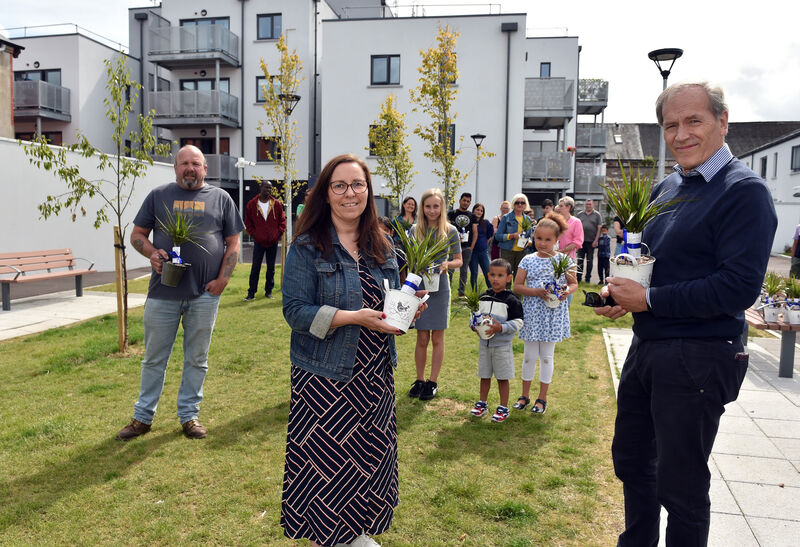  (Front - left to right) Val O'Mahoney of the Gables Bar, Davina Mooney, Cluid housing officer, and Peter Murphy, architect from The Douglas Street Business Association, presenting plants to residents of the Rutland Square White Street scheme last year where nine homes were built on a former derelict site. Pictureo: Eddie O'Hare