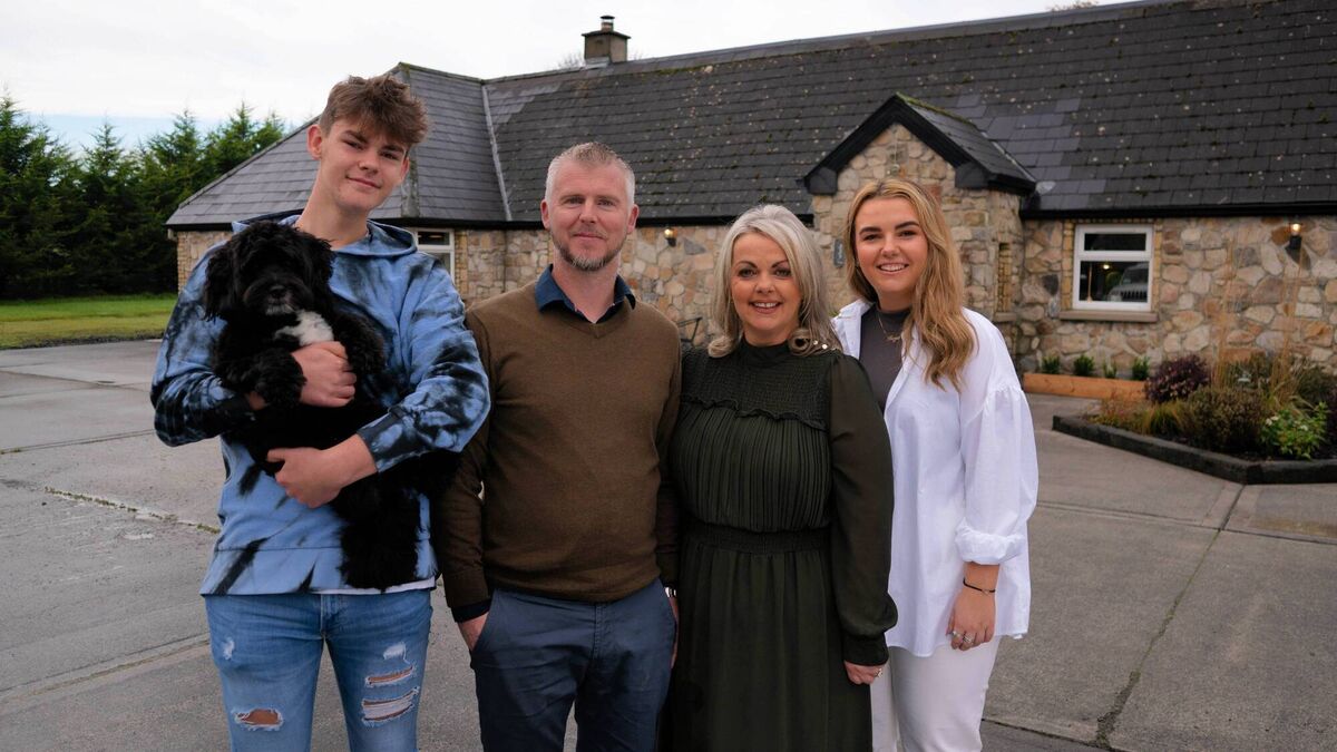 Caroline and Jason with their family at their Longford home. 