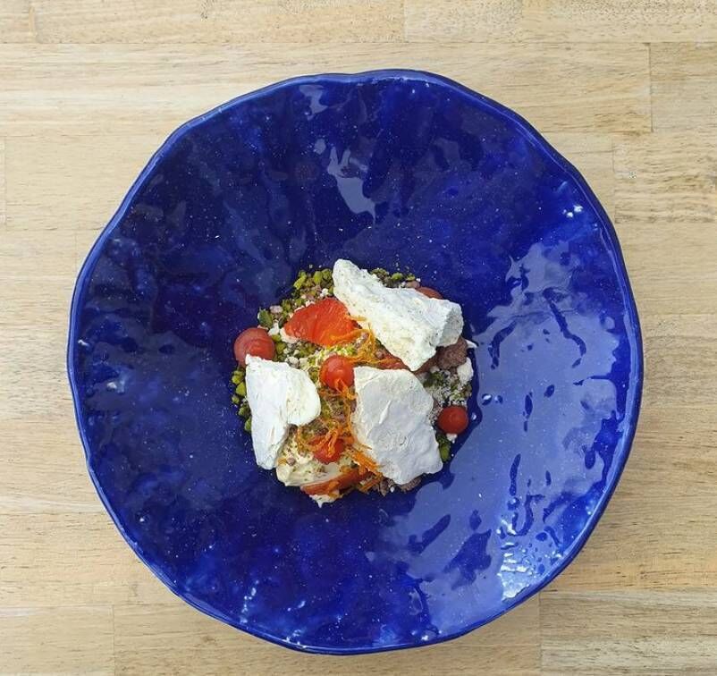 White chocolate mousse, blood orange, meadowsweet meringue, pistachio & chocolate crumb White chocolate mousse, blood orange, meadowsweet meringue, pistachio & chocolate crumb