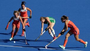 <p>LONDON, ENGLAND - AUGUST 05: Kathryn Mullan of Ireland passes the ball whilst under pressure from Netherlands players during the FIH Womens Hockey World Cup Final between Netherlands and Ireland at Lee Valley Hockey and Tennis Centre on August 5, 2018 in London, England. (Photo by Kate McShane/Getty Images)</p>