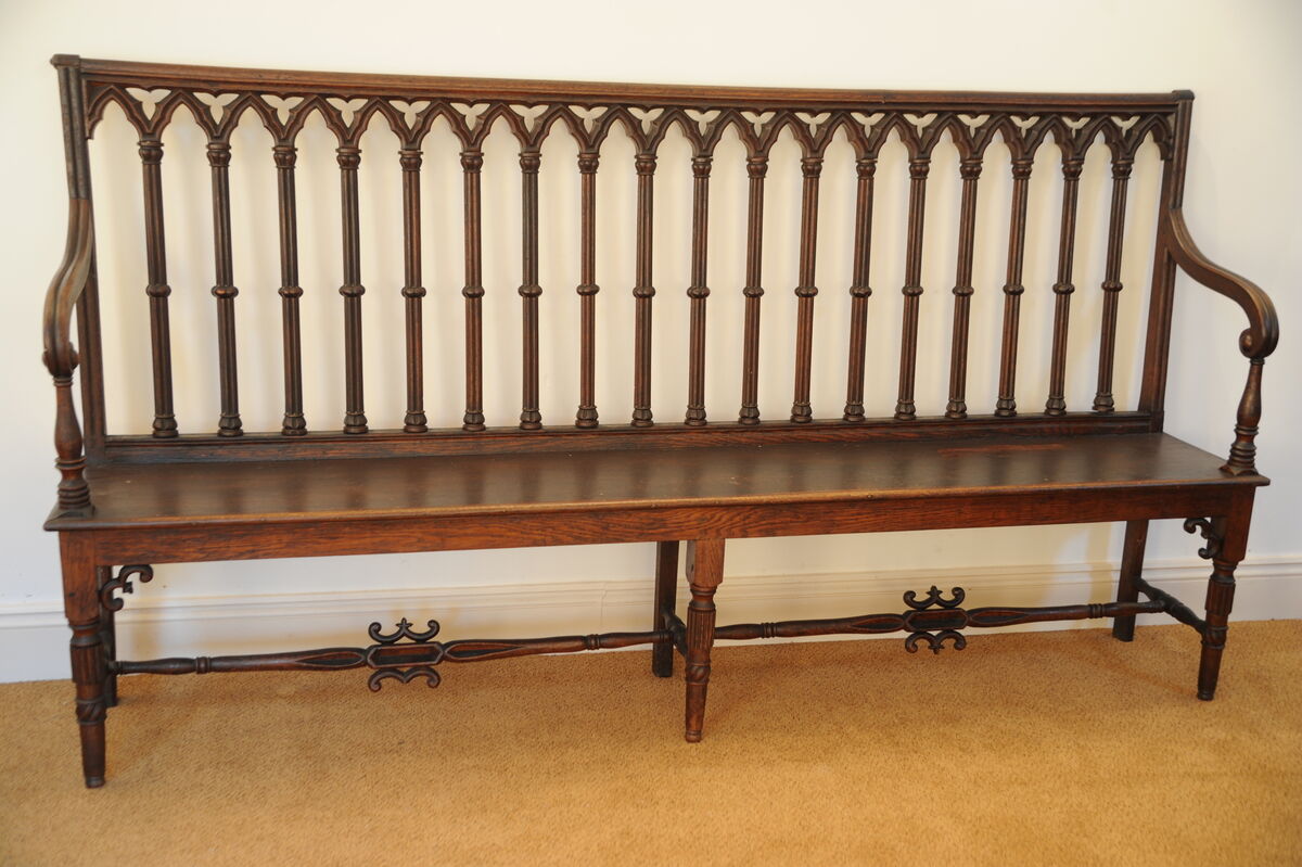 A Gothic oak carved bench at Marshs. A Gothic oak carved bench at Marshs.