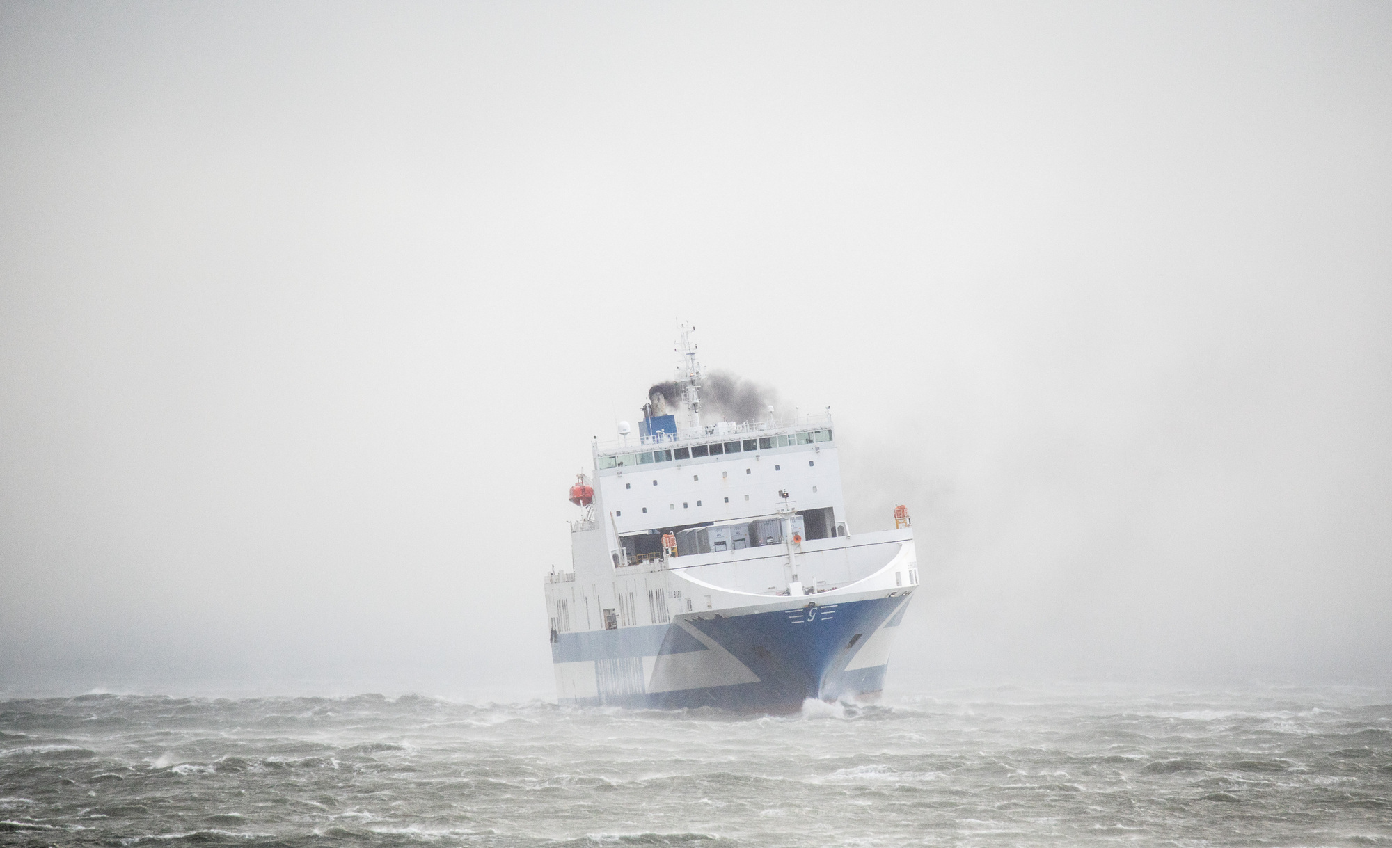  Myrtleville, Cork, Ireland. 18th February, 2022. Ro-Ro Ferry Eurocargo Bari get battered by Storm Eunice outside the harbour off Myrtleville, Co. Cork, Ireland. - Picture David Creedon