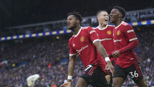 <p>Manchester United's Fred, left, celebrates after scoring his side's third goal during the English Premier League soccer match between Leeds United and Manchester United, at Elland Road Stadium in Leeds, England, Sunday, Feb. 20, 2022. (AP Photo/Jon Super)</p>