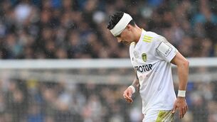 <p>Leeds defender Robin Koch reacts after receiving medication following a collision with Manchester United's Scottish midfielder Scott McTominay in Sunday's Premier League game at Elland Road.  	Picture: Paul Ellis/AFP via Getty Images</p>