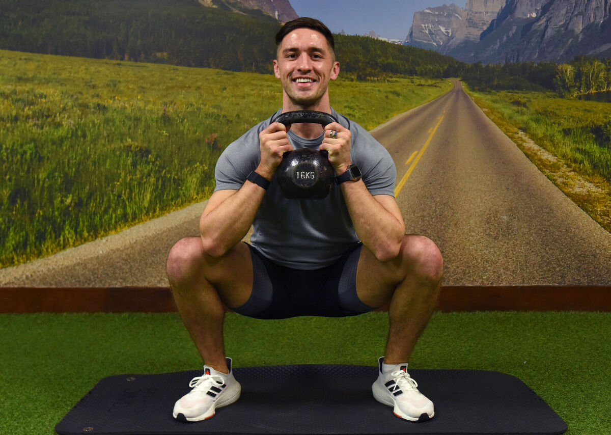  Greg O'Shea demonstrating a goblet squat. Photograph Moya Nolan