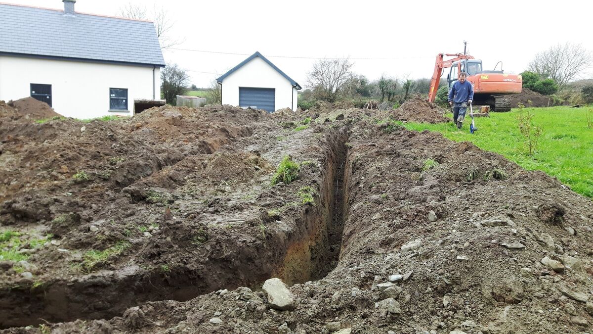 Geothermal heating can be run on vertical or horizontal arrays. Here the dig out of the horizontal array for Jon and Mary Creaseís home dwarfs the site ñ the advantage of having a handy acre of ground. The independent grant aid for heat pump installation has increased through the SEAI to 4500-6500 depending on the building's type.
