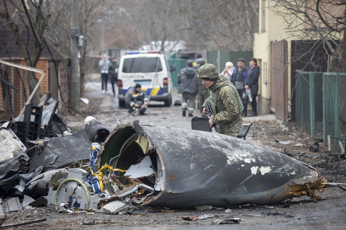 A Ukrainian Army soldier inspects fragments of a downed aircraft in Kyiv, Ukraine. Picture AP Photo/Vadim Zamirovsky