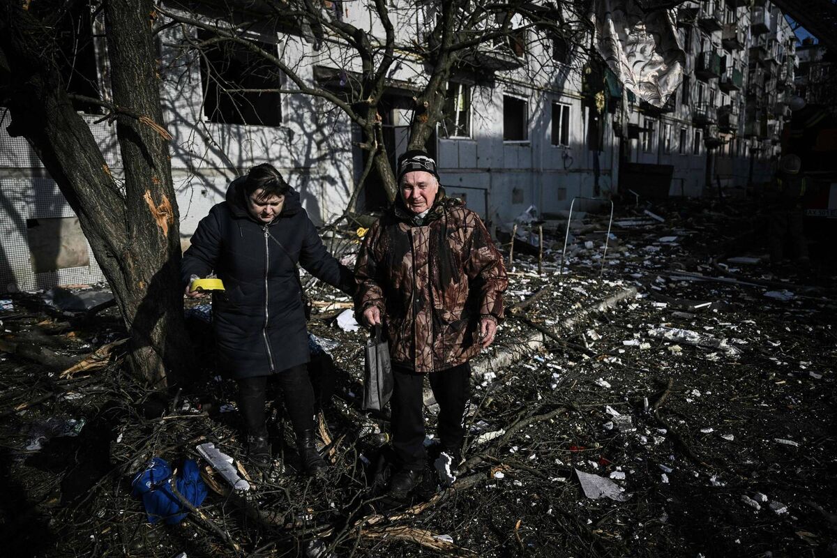 This is where people's retweets and 'likes' of online disinfo and conspiracy theories end up: Weeping residents of Chuguev outside a destroyed building after Russian bombings on the eastern Ukraine town. Out of shot is the body of a relative. Picture: Aris Messinis/AFP/Getty