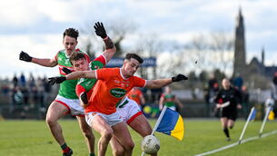 <p>27 February 2022; Connaire Mackin of Armagh in action against Jordan Flynn of Mayo during the Allianz Football League Division 1 match between Mayo and Armagh at Dr Hyde Park in Roscommon. Photo by Ramsey Cardy/Sportsfile</p>