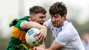 <p>Kerry's Diarmuid O'Connor with Darren Hughes of Monaghan</p>