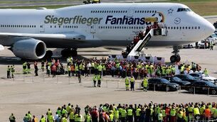German team has some fun unveiling World Cup trophy at homecoming