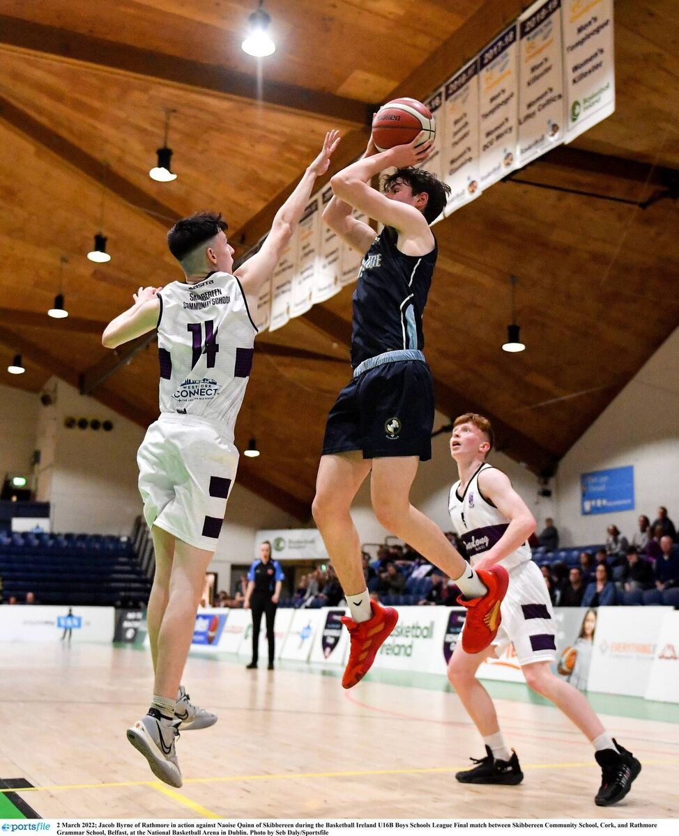 JUMPER: Jacob Byrne of Rathmore in action against Naoise Quinn of Skibbereen during U16B Boys final. 