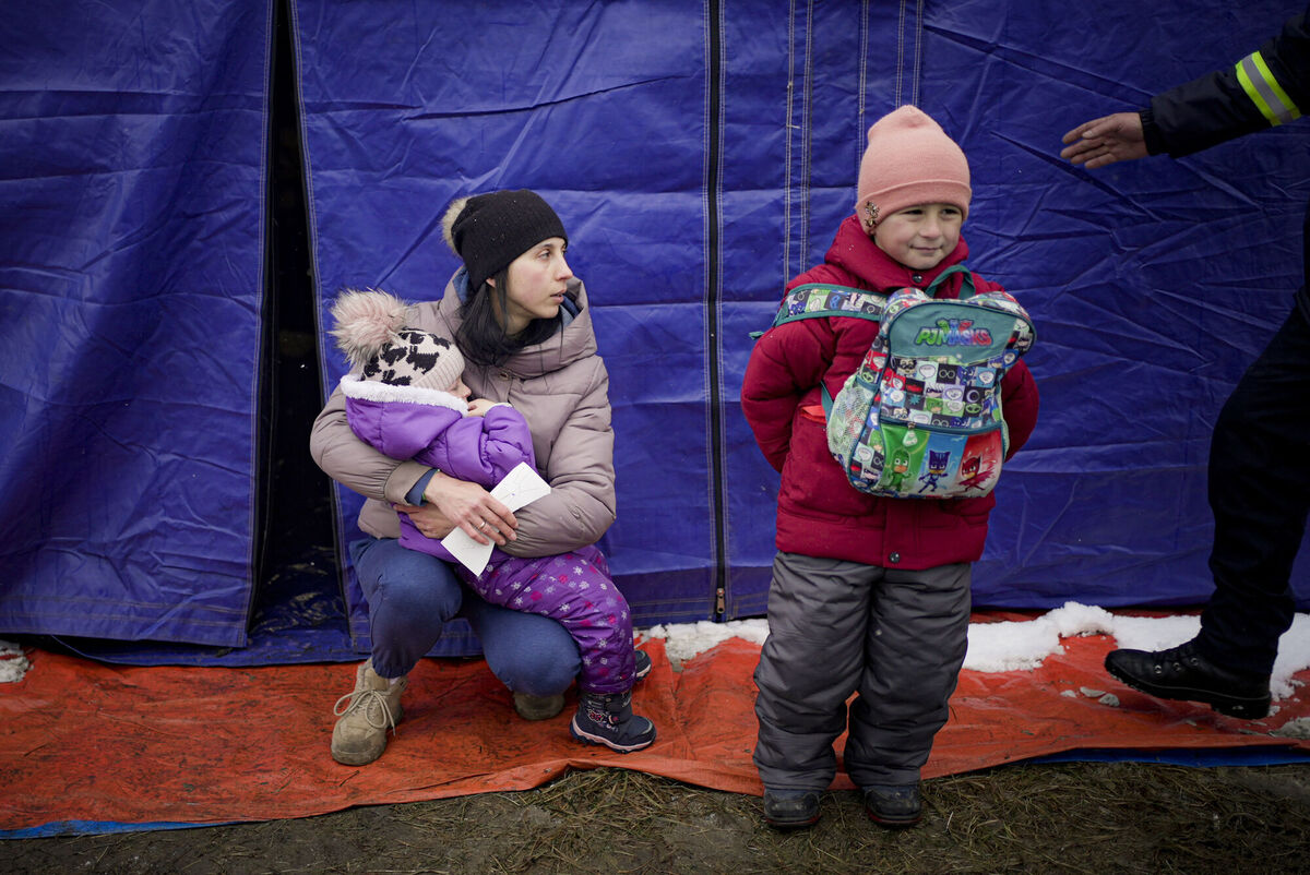Sasha Moskalu and her two-year-old daughter Sofia and six-year-old son Danic take shelter after fleeing to Romania from Ukraine. The UN estimates that 1m people have fled the war. Pic: Renata Brito/AP