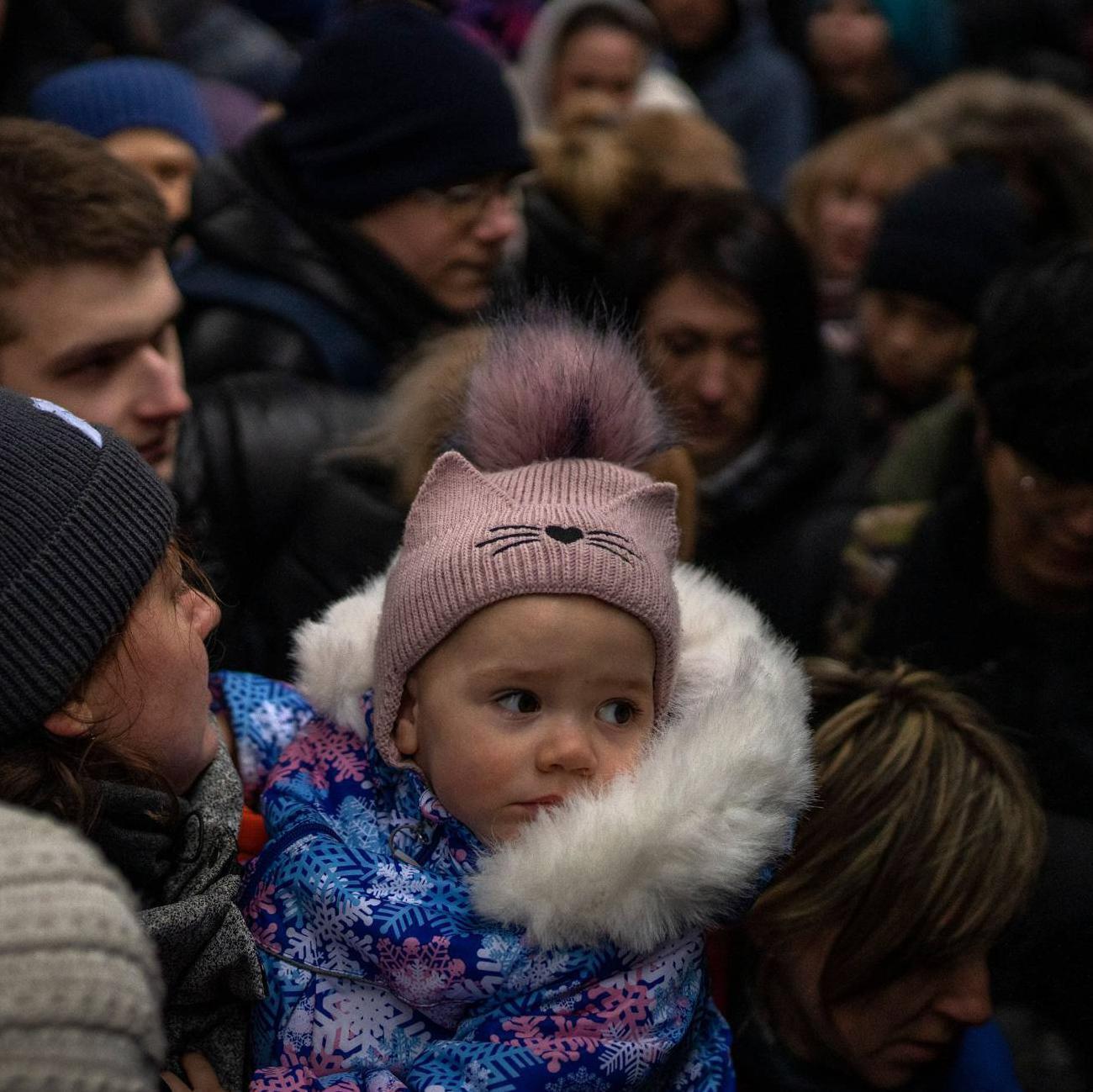 Women and children trying to get onto a train bound for Lviv, at Kyiv station in Ukraine.