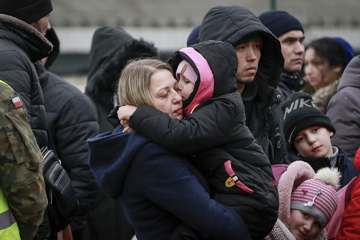 A child kisses her mother as they flee Ukraine to enter Poland through the border crossing Korczowa, Poland, Friday, March 4, 2022.Picture: AP Photo/Visar Kryeziu A child kisses her mother as they flee Ukraine to enter Poland through the border crossing Korczowa, Poland, Friday, March 4, 2022.Picture: AP Photo/Visar Kryeziu