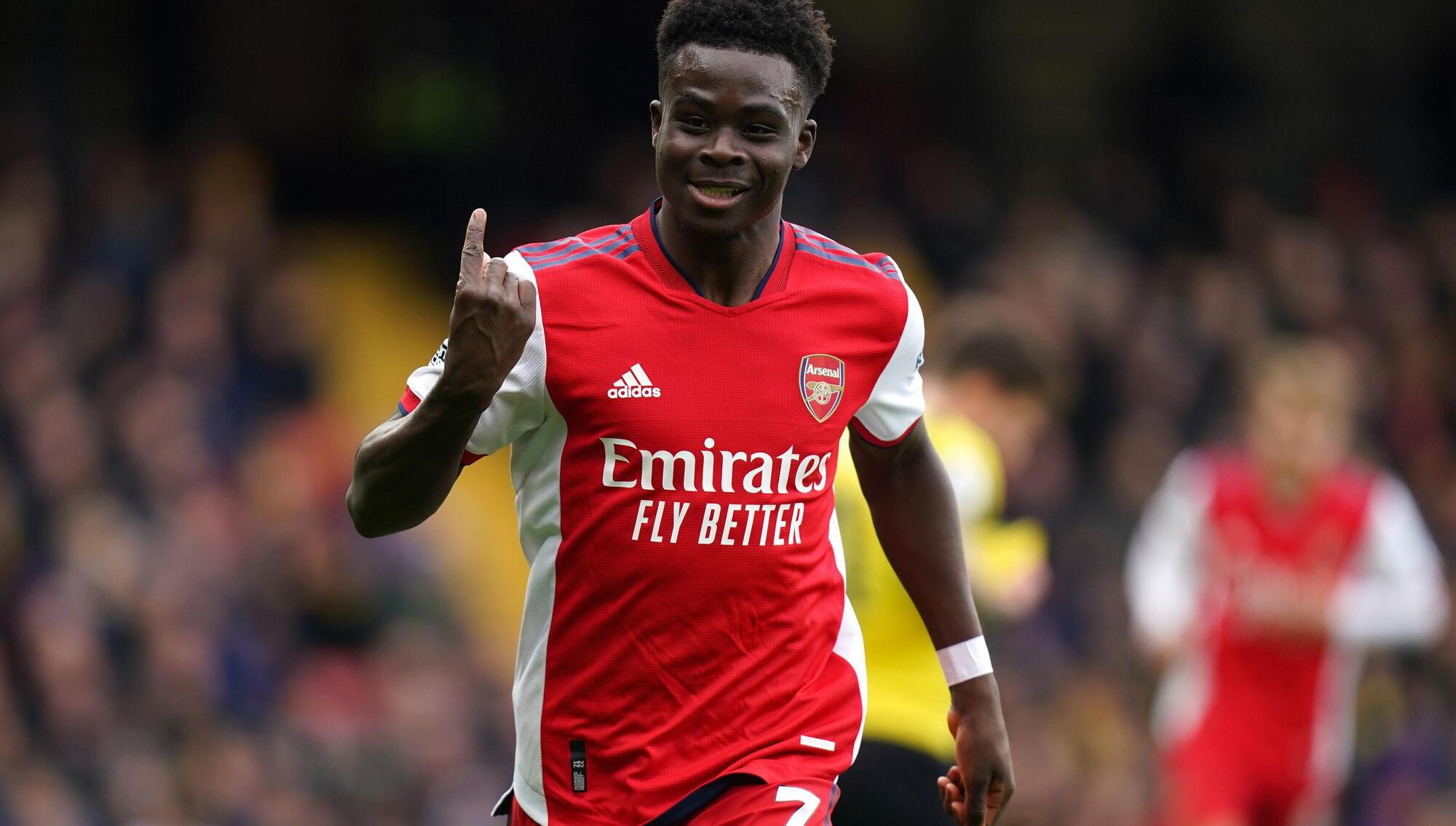 Splendid Saka steers Arsenal into fourth despite late scare