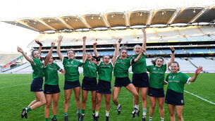 <p>Sarsfields players, from left, Cora Kenny, Shannon Corcoran, Rachel Murray, Tara Kenny, Siobhán McGrath, Orlaith McGrath, Maria Cooney, Joanne Daly, and Clodagh McGrath celebrate after their side's victory in the AIB All-Ireland Senior Camogie Club Championship final against Oulart the Ballagh in Croke Park</p>