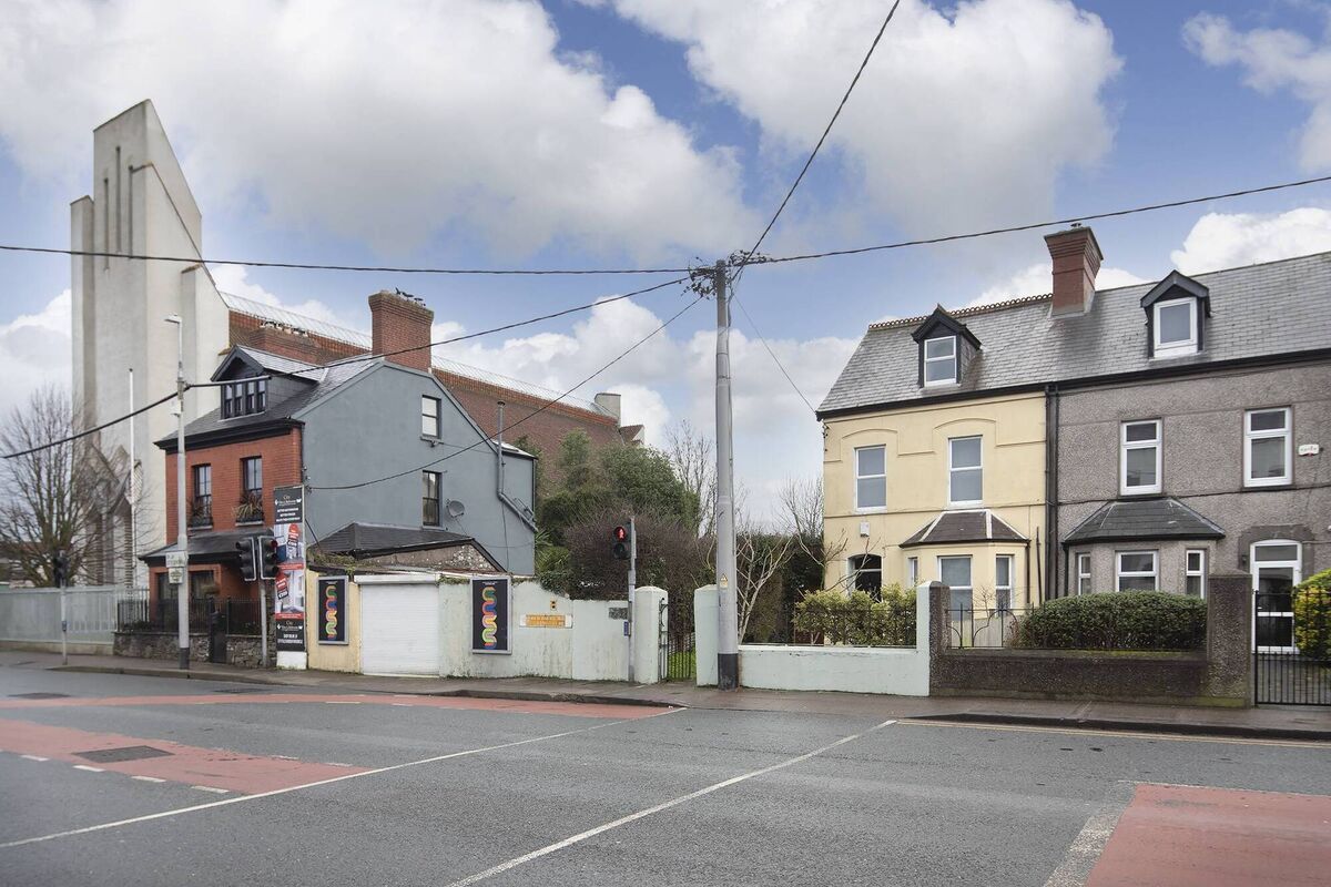 Percyville (painted cream) is next to the 1931-completed Christ the King church and the former Kiely's shop (red brick, centre) at Cork's Turner's Cross 