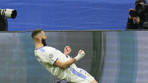 <p>Real Madrid's Karim Benzema celebrates scoring his side's third goal during the Champions League, round of 16, second leg soccer match between Real Madrid and Paris Saint-Germain at the Santiago Bernabeu stadium in Madrid, Spain, Wednesday, March 9, 2022. (AP Photo/Manu Fernandez)</p>