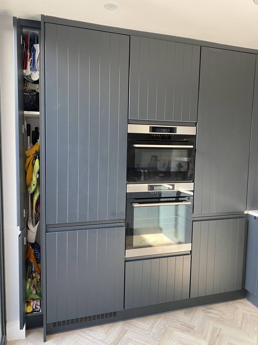 The slim broom cupboard in Jen's kitchen, left. 