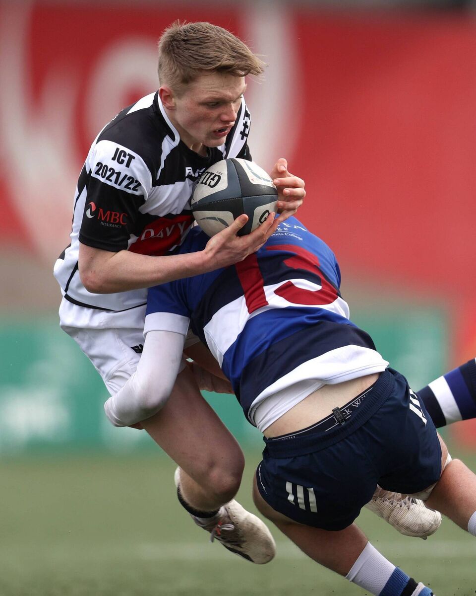 Pres centre Mark Hetherington is tackled by Joshua Boland of Crescent College 