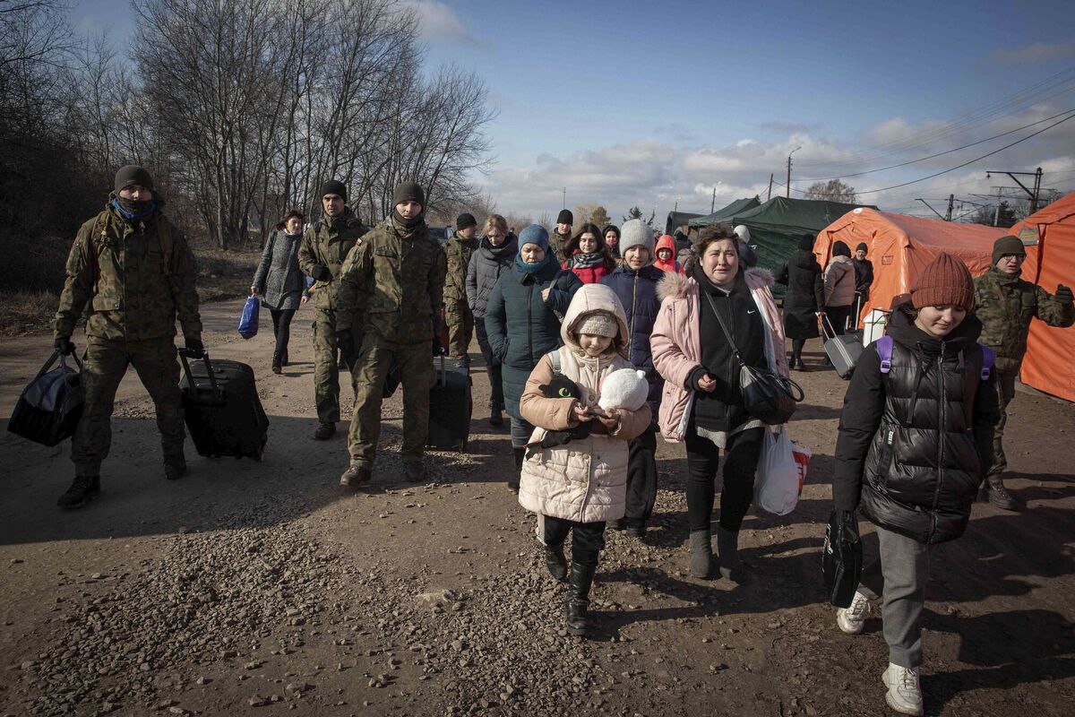 Women and children arrive at a makeshift camp to board a train heading to Krakow after fleeing Ukraine, at the border crossing in Medyka, Poland. Picture: AP Photo/Visar Kryeziu