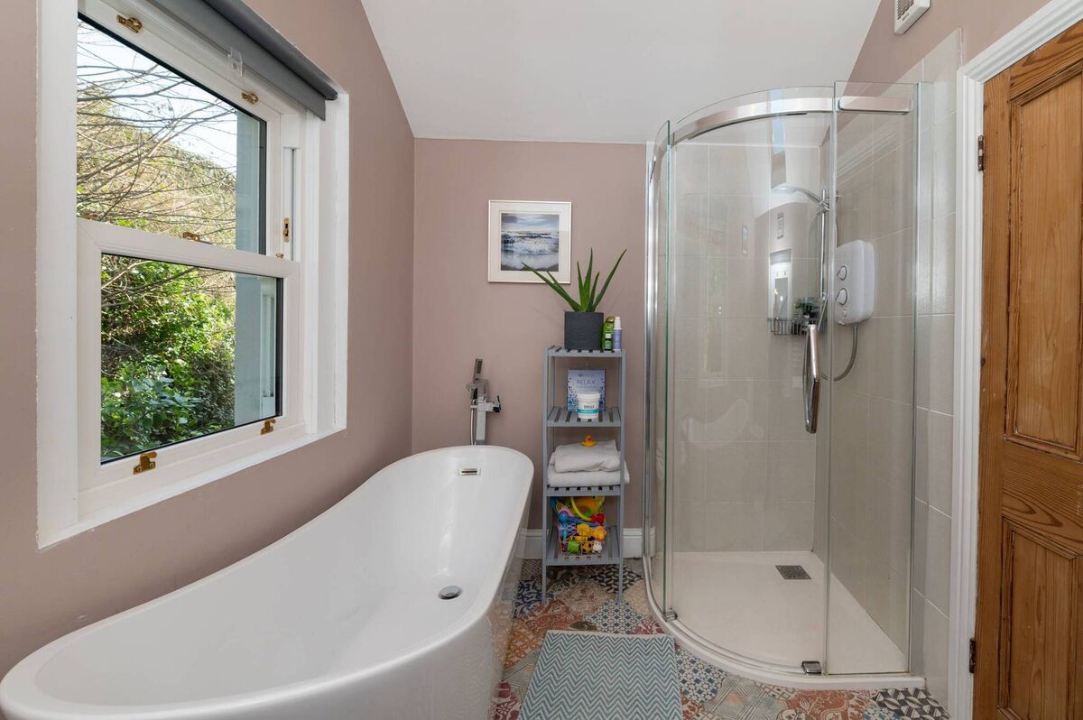 Main family bathroom with shower and freestanding bath
