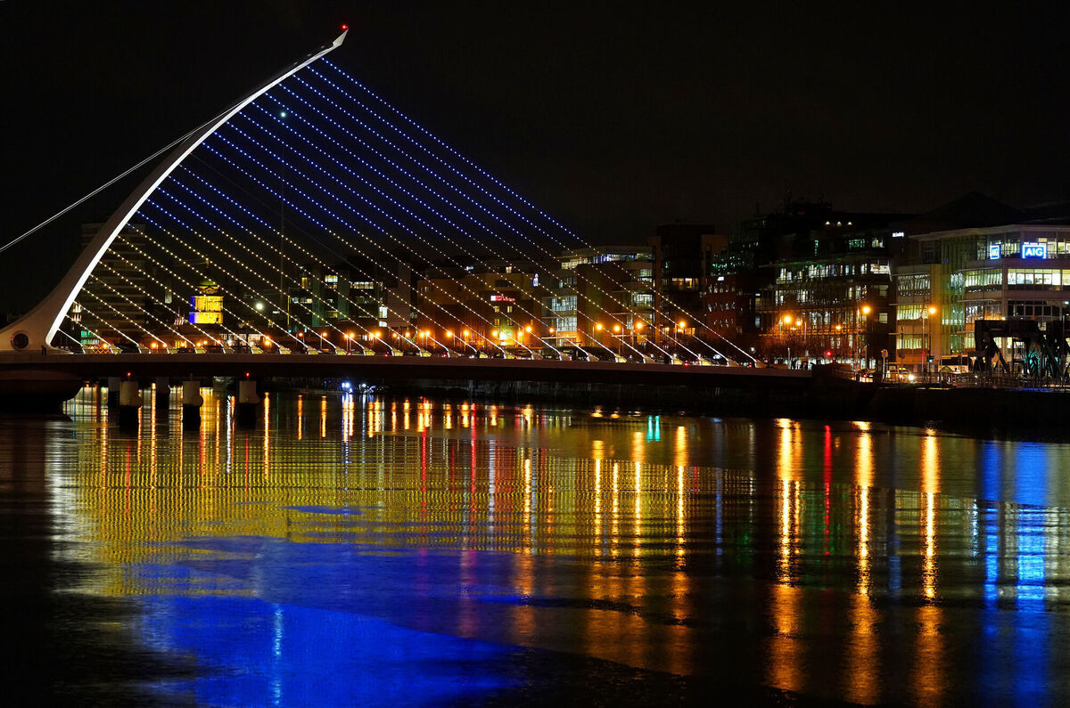 The Samuel Beckett Bridge in Dublin's city centre displays the colours of the Ukrainian flag as a show of support. Picture: Brian Lawless/PA Wire