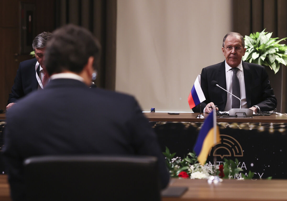 Russia’s Foreign Minister Sergei Lavrov sits in front of his Ukrainian counterpart Dmytro Kuleba, foreground left, during a tripartite meeting on Thursday, March 10. Picture: Cem Ozdel/Turkish Foreign Ministry/AP